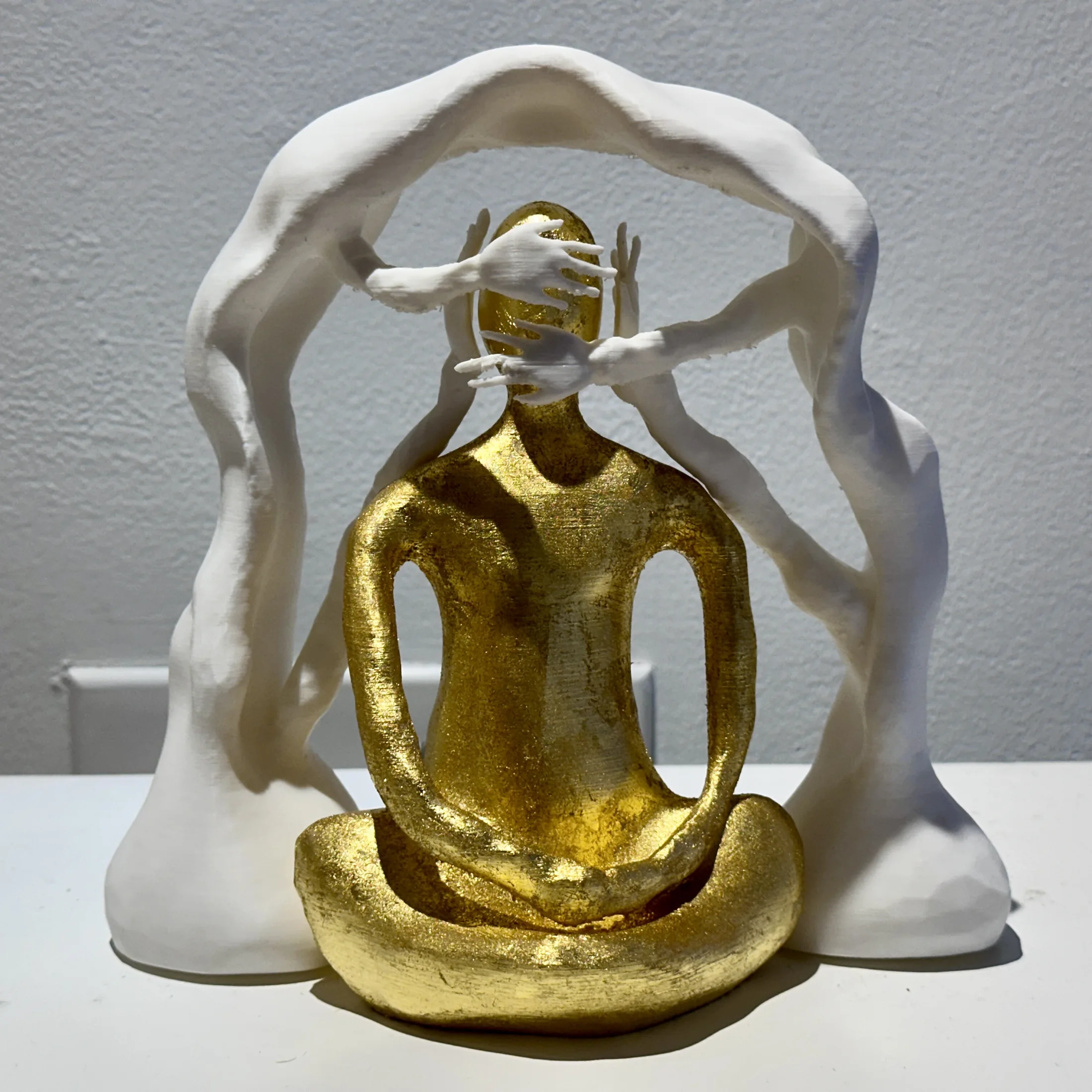 Gold and white sculptural form from Inverted Normals.