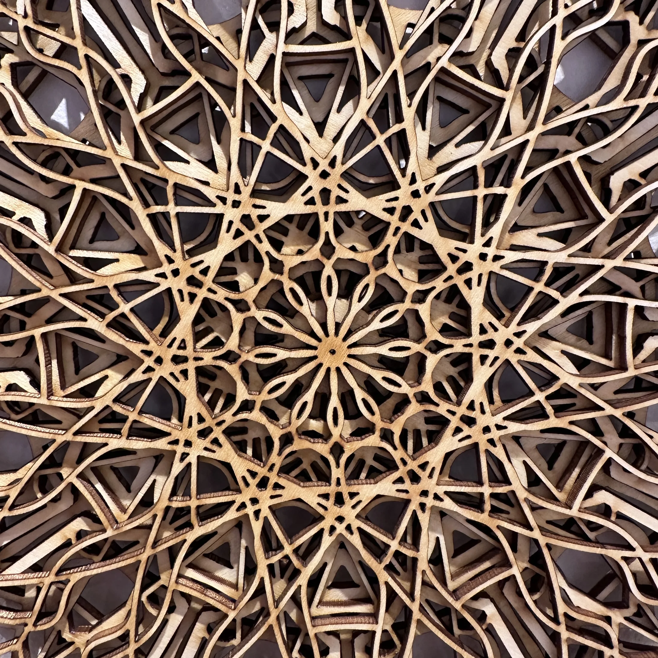 Laser-cut jigsaw detail from Inverted Normals.
