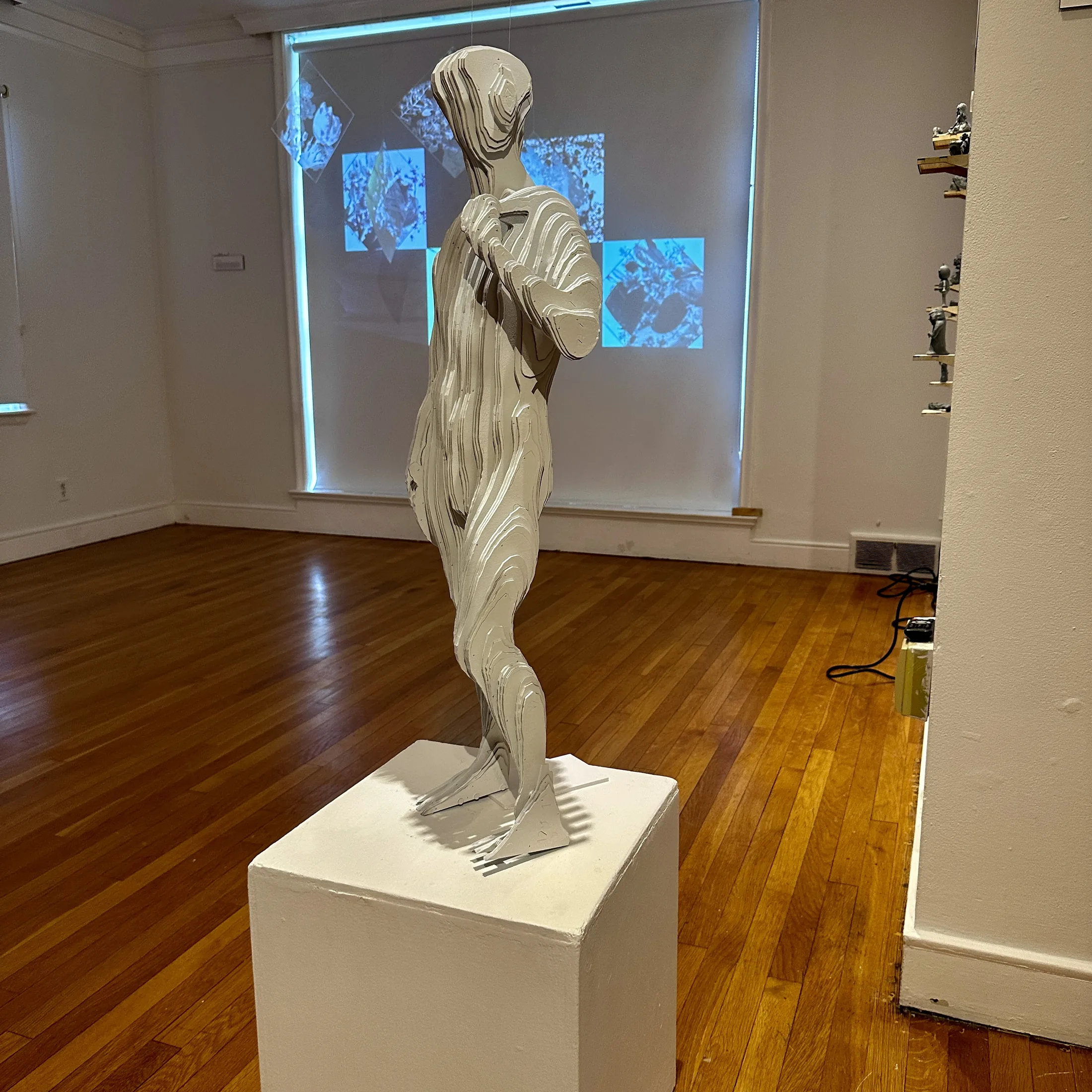 Figural sculpture installation view from Inverted Normals.