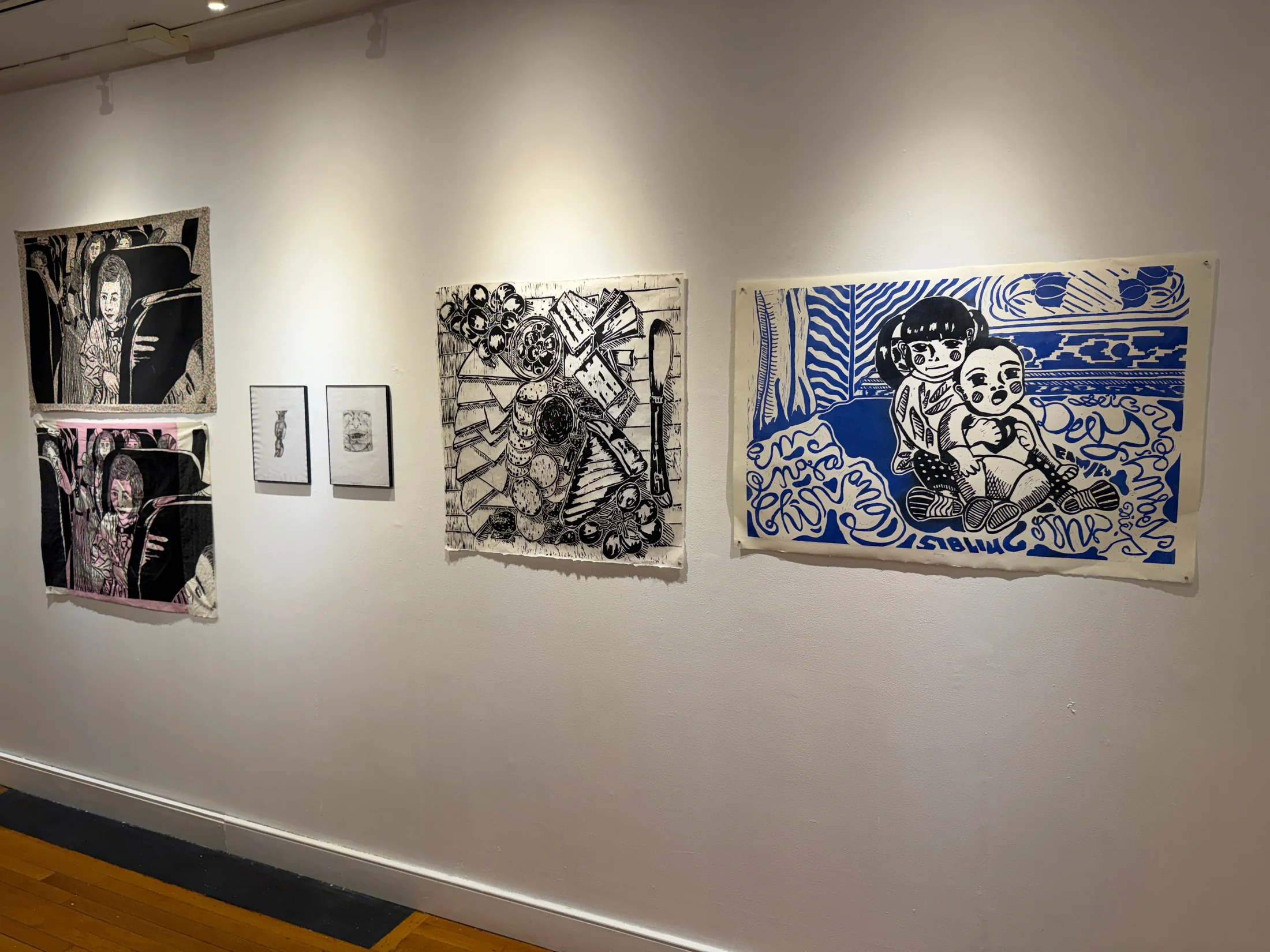Gallery wall with student prints.