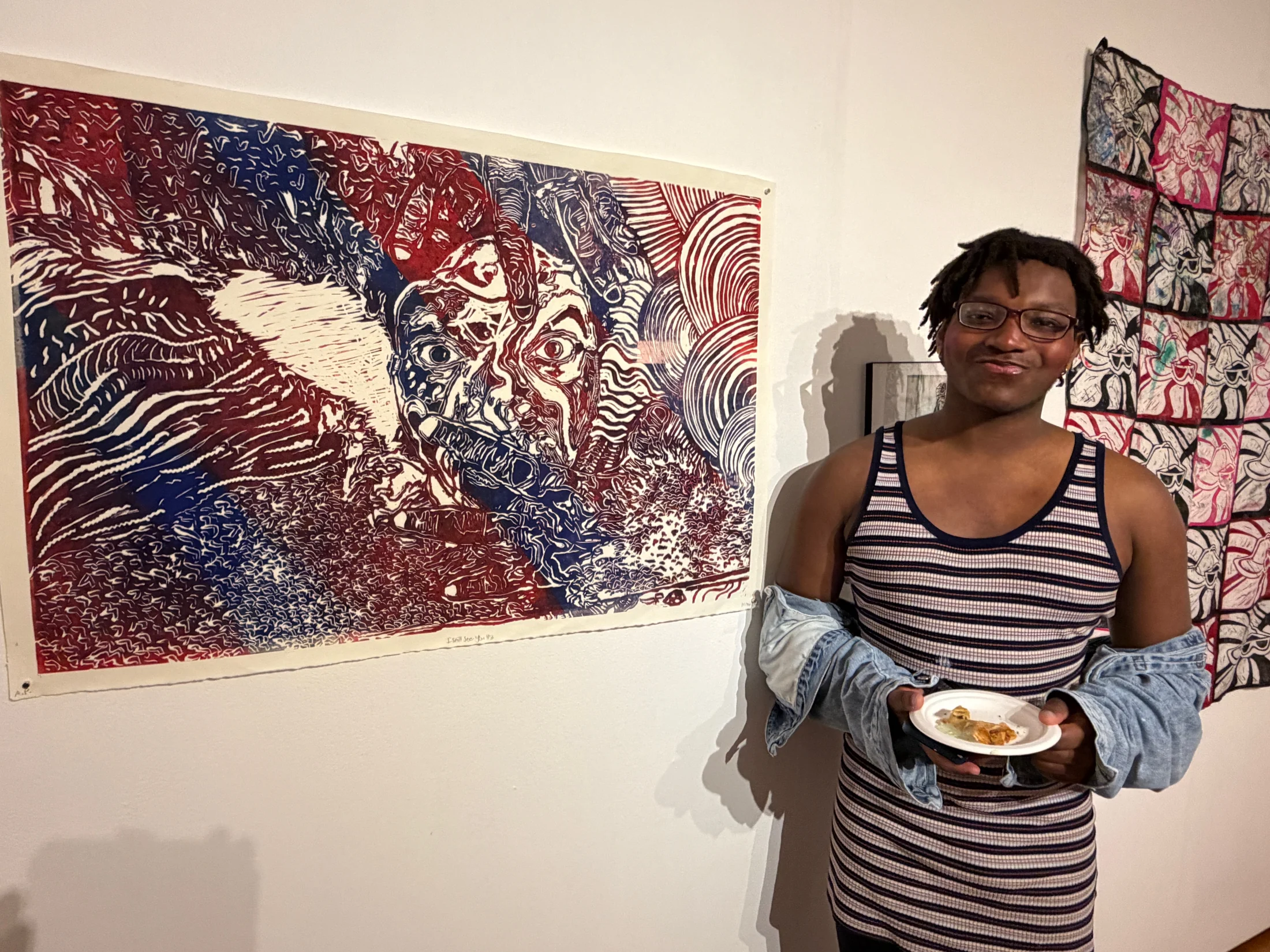 Student artist with large-scale print.