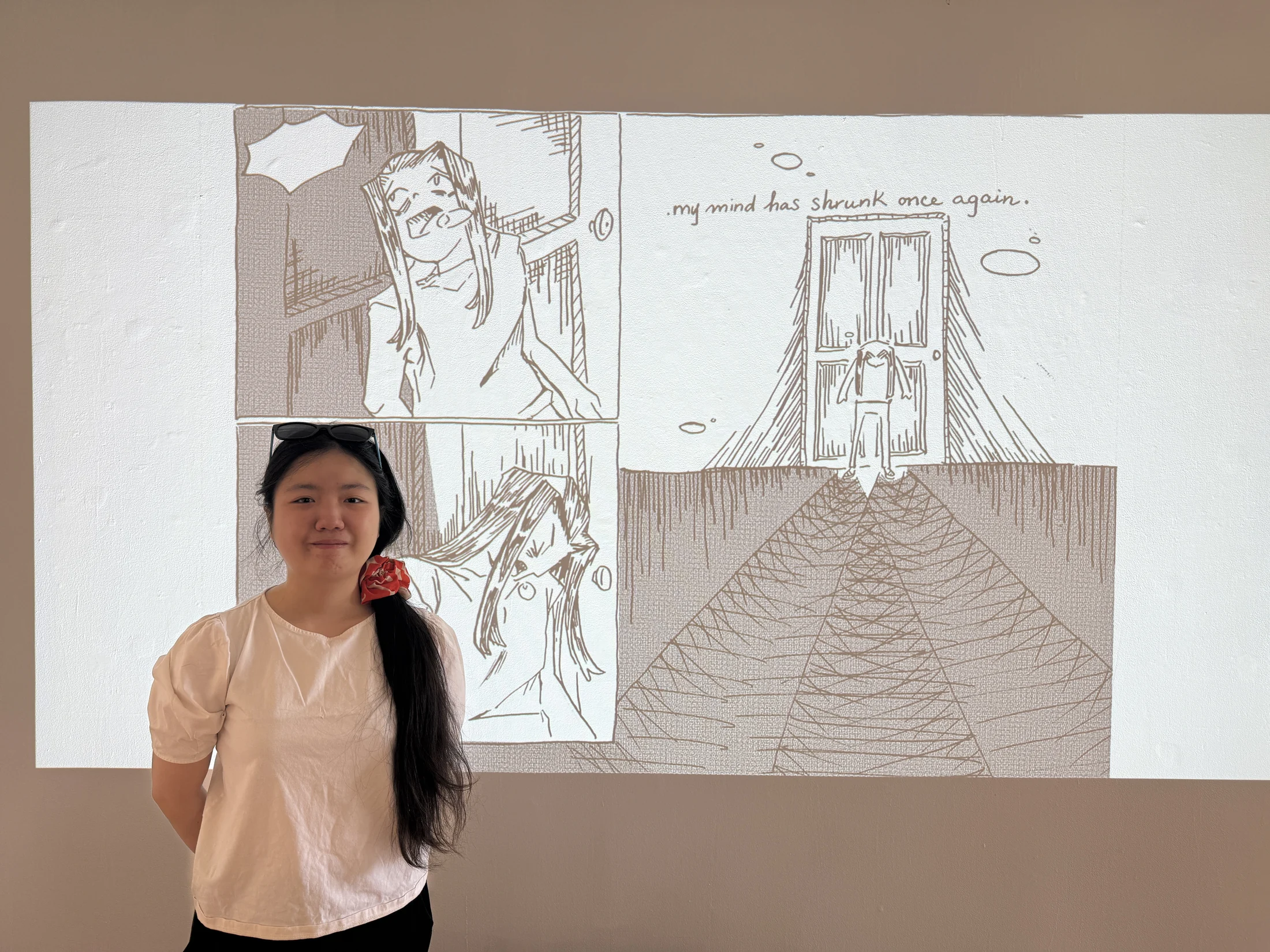 Amy Nguyen with projected artwork in Fantastical Fright in Life.
