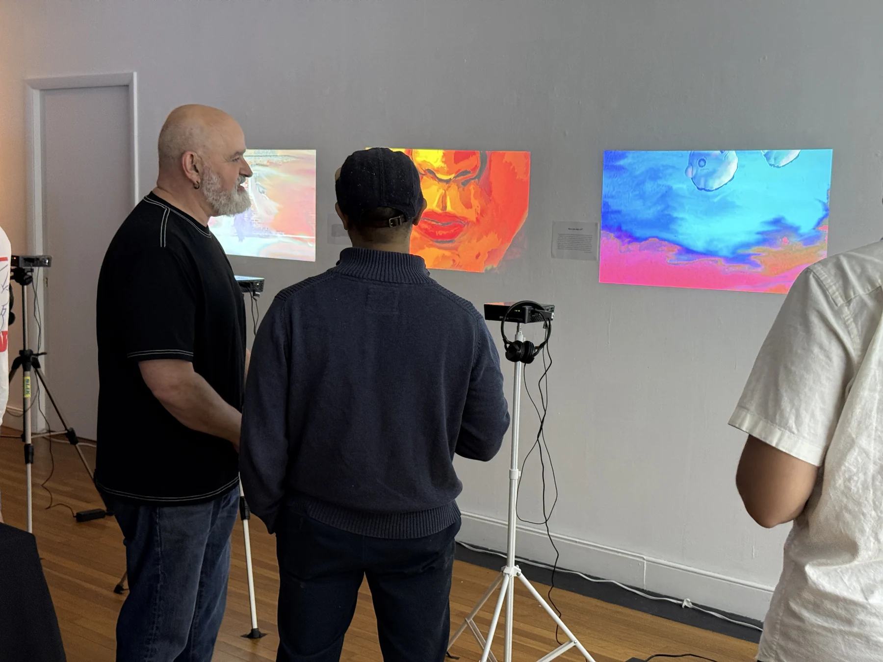 Visitors gathered near projected animation works.