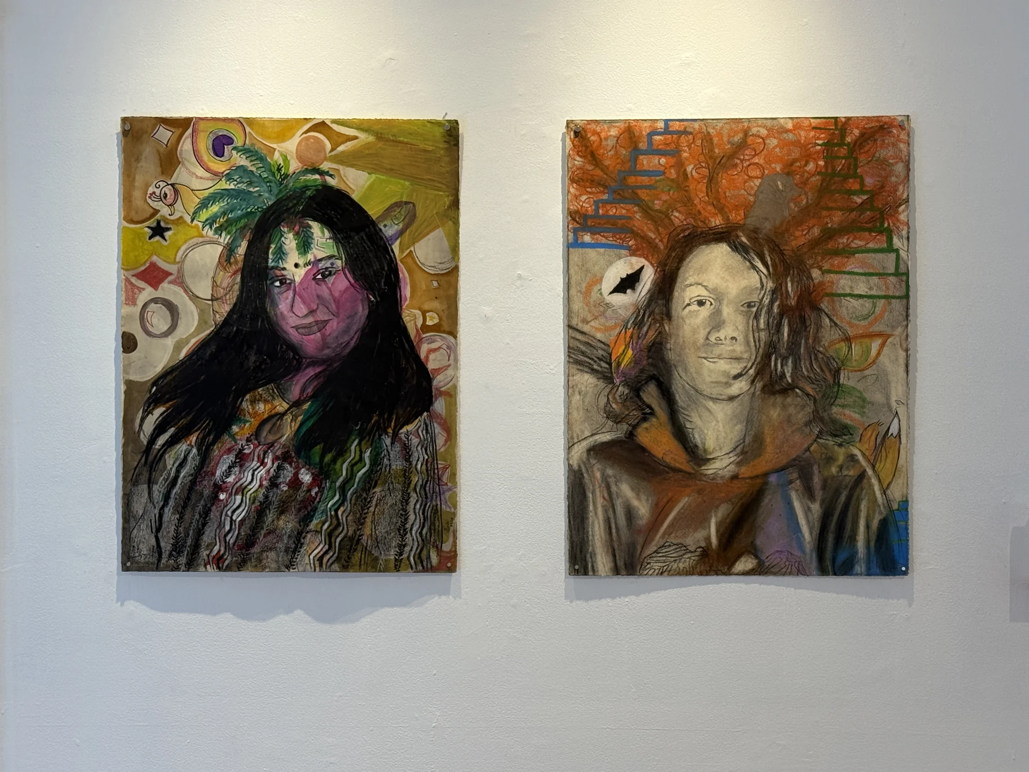 Two self-portrait drawings with layered colors and symbolic forms.