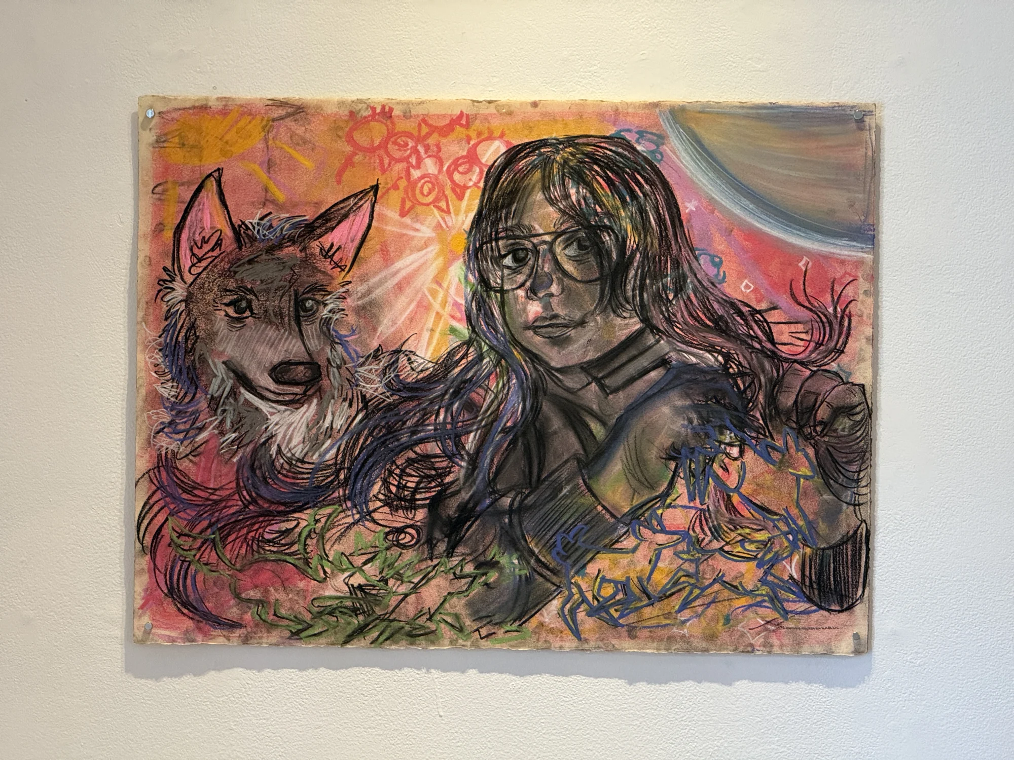 A colorful self-portrait drawing with a large canine figure beside the face.