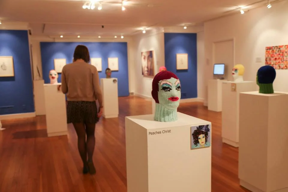 Gallery installation with visitors in the space.