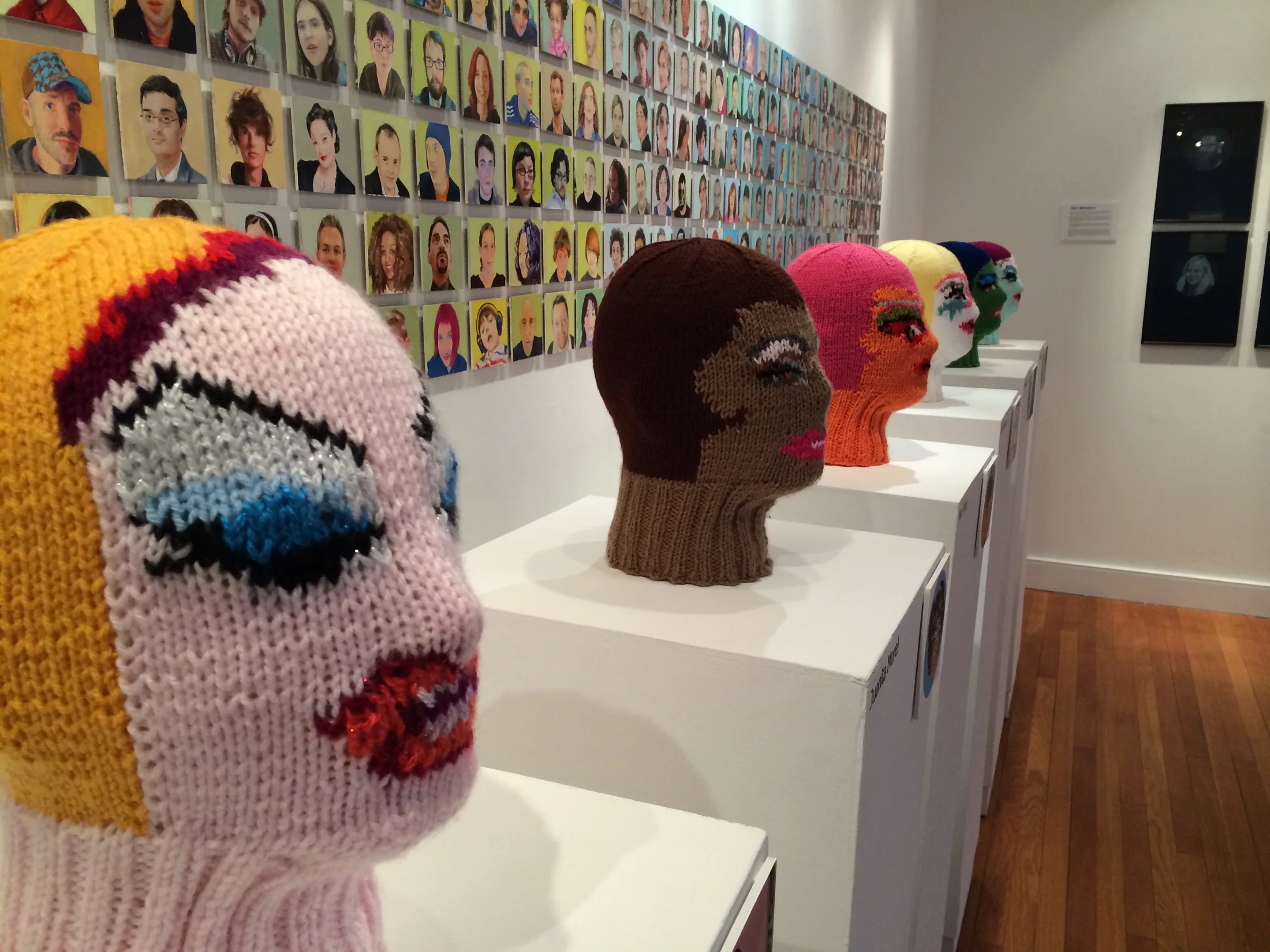 Installation view with sculptural work and gallery lighting.