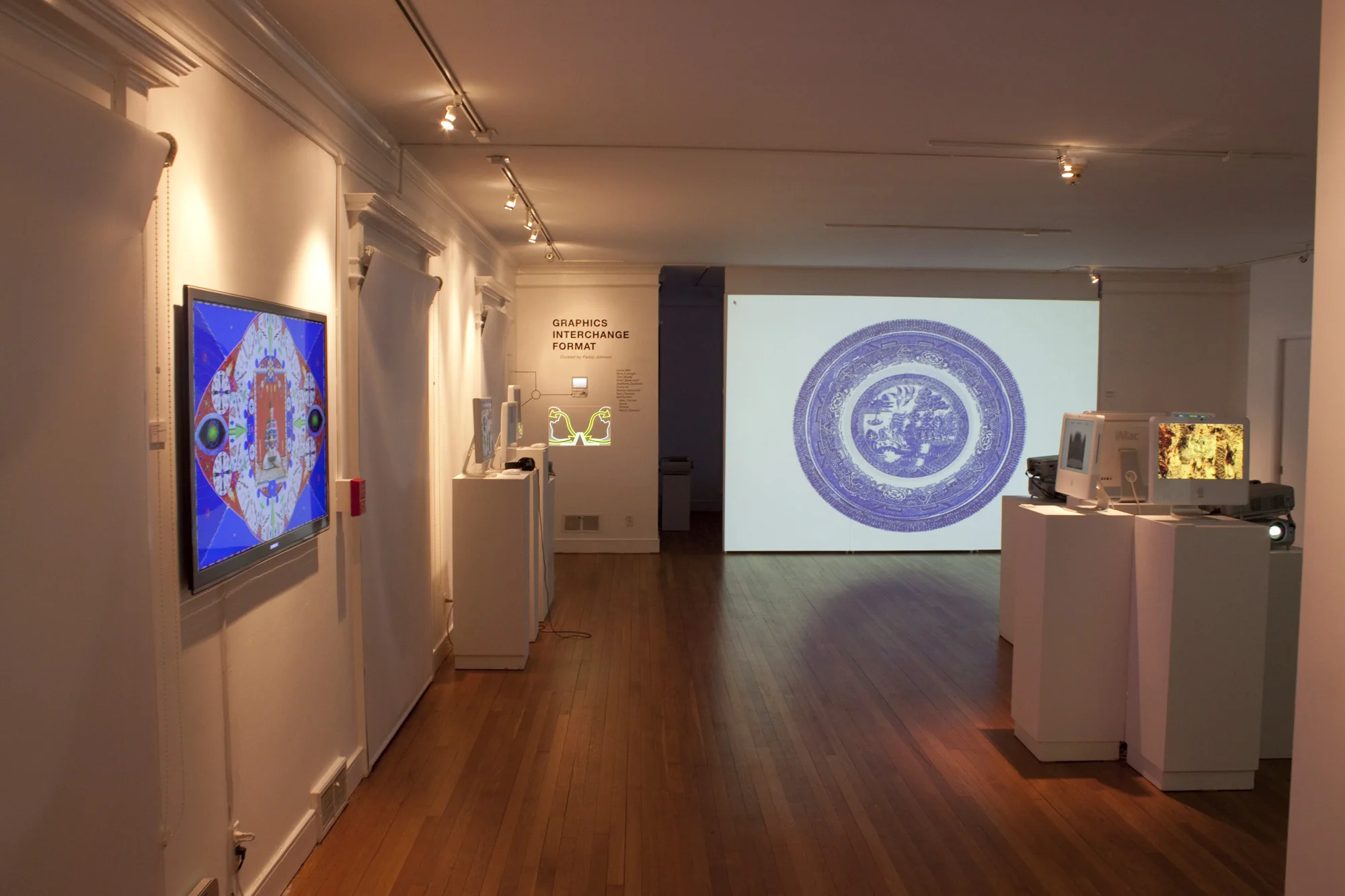 Contemporary exhibition installation with works on the wall.